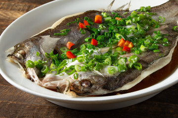 A closeup view of a poached seabass entree.