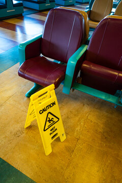 Sign warning of slippery floors on a Seattle ferry, Slippery When Wet. 