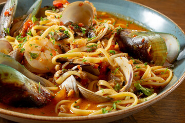 A closeup view of a plate of linguine tutto mare.