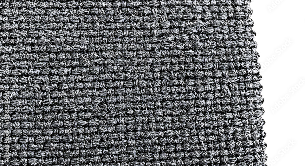 Poster close-up of a tightly woven, coarse gray fabric with a distinct grid pattern, highlighting its robus