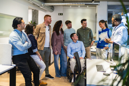 Creative professionals engaging in teamwork, fostering innovation, and achieving shared goals within a dynamic coworking environment