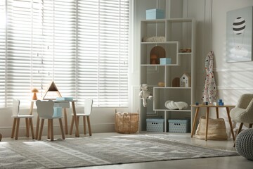 Stylish playroom with decor and furniture. Interior design