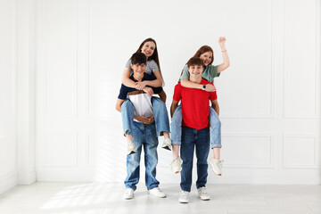 Fototapeta premium Group of teenagers having fun together indoors