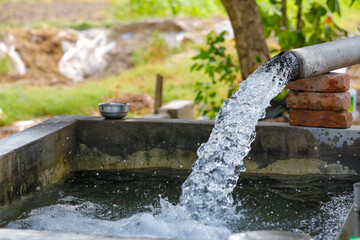 Water flow from pump at agriculture field.