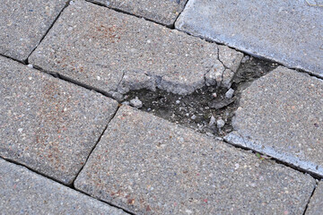 Big hole with water crack in asphalt