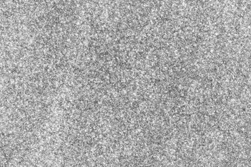 Close-up of a fine-grained, speckled, and textured surface.