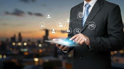 Businessman interacts with digital interface on tablet against a city skyline at dusk. - Powered by Adobe