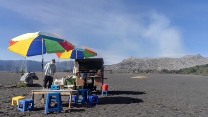 Local Food Vendor with Colorful Umbrellas at Active Mount Bromo Volcano, Indonesia