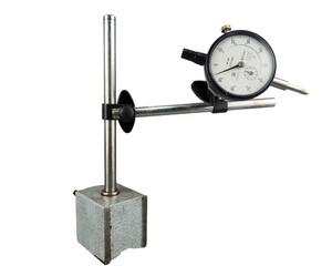 Dial gauge with magnetic base checking on steel plate for engineer inspector isolated on white...