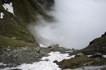 Climbing a high-mountain trail in the Tatra Mountains, to the peak of Rysy.
