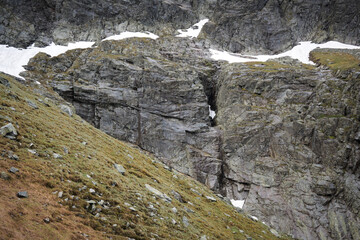 Mountain trekking, gaining heights, high-mountain landscape.
