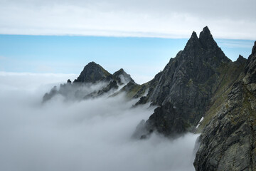 Mountain peak above the clouds, mountain landscape.
