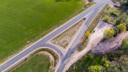Empty Road Surrounded by Green Fields and Nature
