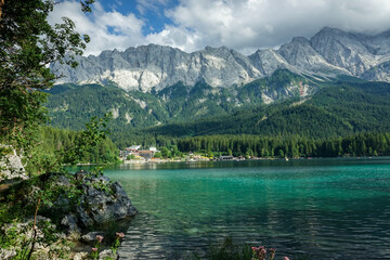Alpine summer day at Eibsee with turquoise water and Zugspitze in the background in southern Germany