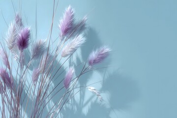 Minimal pastel floral composition with purple grass on blue background