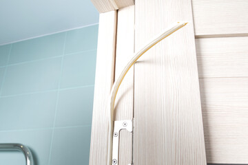 the sealing rubber sticks out of the door frame, wooden opening