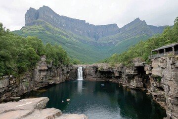 Majestic waterfall cascading into a tranquil alpine lake, framed by rugged mountains and lush greenery