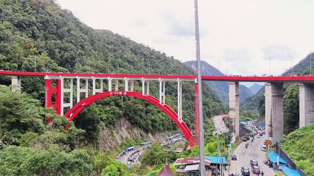 Iconic flyover at Kelok 9 or Nine sharp turns, a road connecting Riau and West Sumatra. West Sumatra, Indonesia - April 02, 2025.