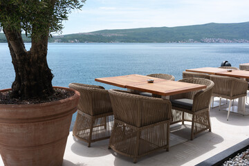 Wooden cafe tables with sea view