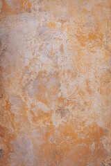 Colorful textures of aged plaster reveal intricate patterns, merging earthy tones with subtle textures in a rustic setting that evokes warmth