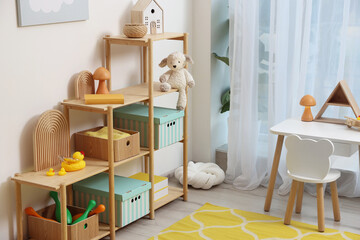 Stylish playroom with toys and furniture. Interior design