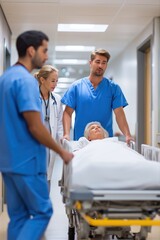 Obraz premium Healthcare professionals transporting elderly patient on hospital gurney in corridor