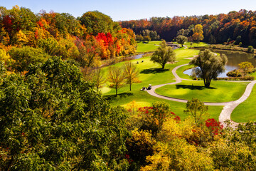 Golf Course in the autumn season. Colorful autumn trees and shrubs on the golf course. View from above. Oakville, Ontario, Canada