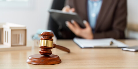 Gavel and Lawyer Taking Notes in Office