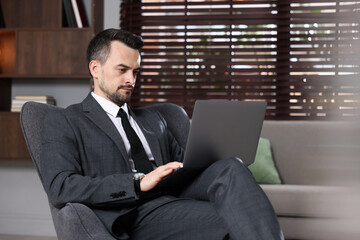 Professional psychologist having online consultation with his client via laptop indoors