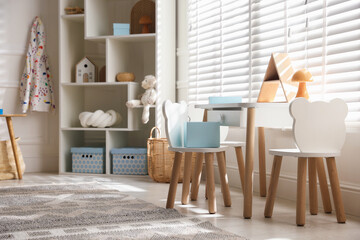 Stylish playroom with decor and furniture. Interior design