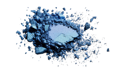 Crushed, vibrant blue eyeshadow powder.  A cluster of fragmented,  angular pieces radiates outwards from a central, lighter shade