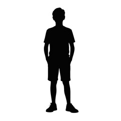 Young man standing with hands in pockets silhouette