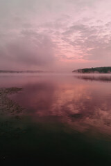 Fototapeta premium photorealistic ultraminimalistic image showcasing foggy morning sky over tranquil body of water