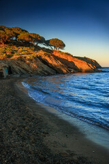 Obraz premium Sunrise at Cap Béar. Sunrise in Catalan country, reflected in the sea surrounded by rocks at Port Vendres in the south of France. Sunrise at Cap Béar. 
