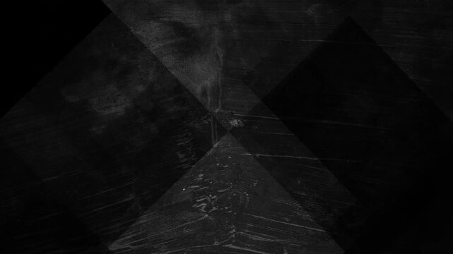 Abstract geometric pattern of intersecting black and dark gray shapes. Suitable for digital backgrounds, web designs, and modern graphic projects.