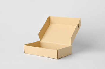 Kraft cardboard mailing box mockup on a gray background