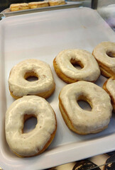 Classic Vanilla Glazed Donuts on White Tray