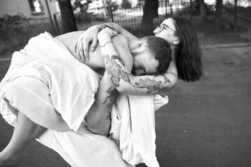 A tender embrace between a couple, capturing a moment of deep affection and closeness.