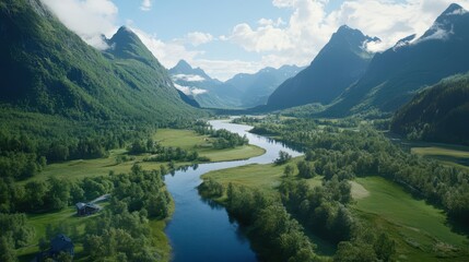 Fototapeta premium Serene Mountain River Vista: A breathtaking landscape featuring a winding river flowing through a verdant valley embraced by towering mountains. Capturing the raw beauty and tranquility of nature.