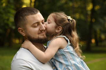 Fototapeta premium Happy Father's Day. Dad and his little daughter spending time together in park