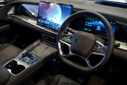 Penang, Malaysia - June 14, 2025: Close-up view of the futuristic interior of the BYD Sealion 7 electric car, featuring a high-tech steering wheel and digital dashboard.