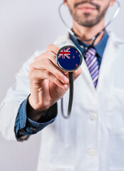 New Zealand health and medical insurance concept. New Zealand healthcare system, doctor holding stethoscope