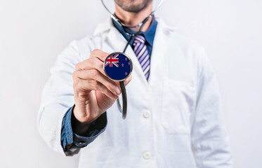 New Zealand healthcare system, doctor holding stethoscope. New Zealand health and medical insurance...