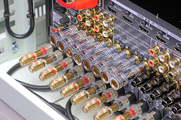 Rear panel of a high-quality AV receiver with multimedia connections for connecting speakers, analog and digital signals. 