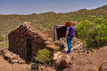 Hiker at abandoned house in Teno