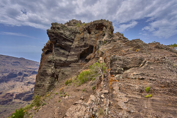 Volcanic cliff with ancient trail steps