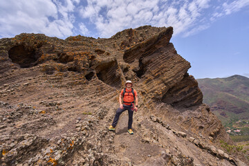 Hiker at volcanic rock caves