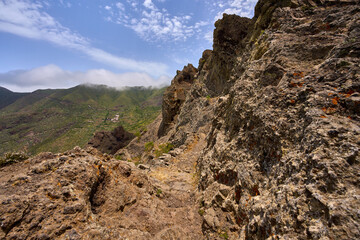 Volcanic cliff with ancient trail steps