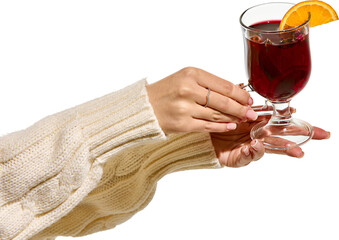 Soft indulgence. Feminine hand with French manicure holds mulled wine with orange slice and herbs....