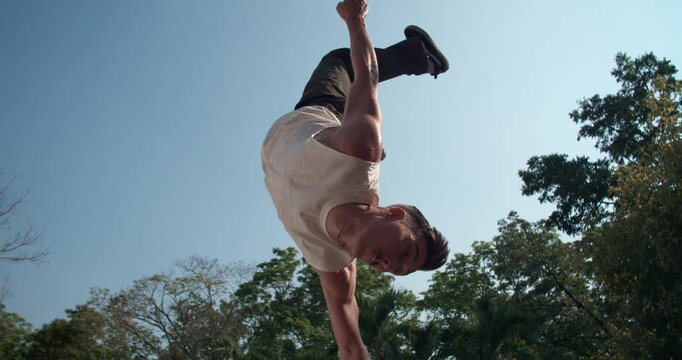 A cinematic time ramp captures a young man's passion for his parkour hobby. Footage shifts from real-time to 1000fps slow motion, showcasing a stylish aerial trick as a form of self-expression.